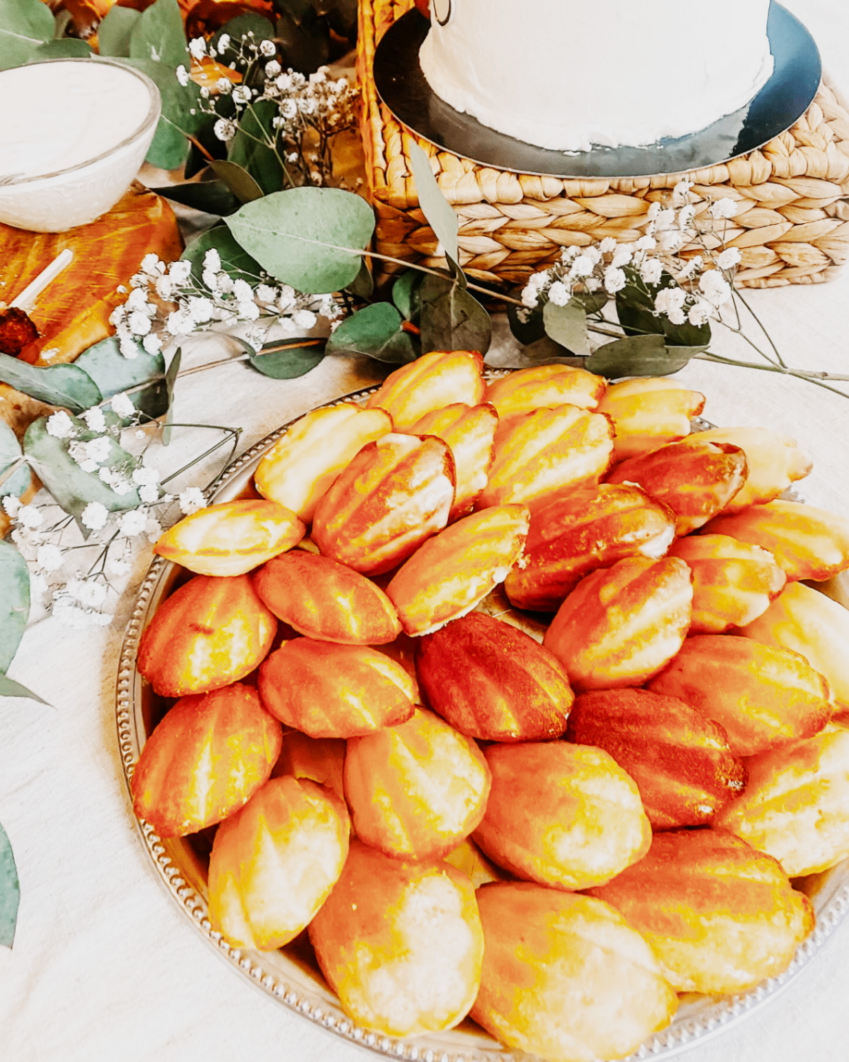 Tray of shell-shaped pastries styled for an event dessert table